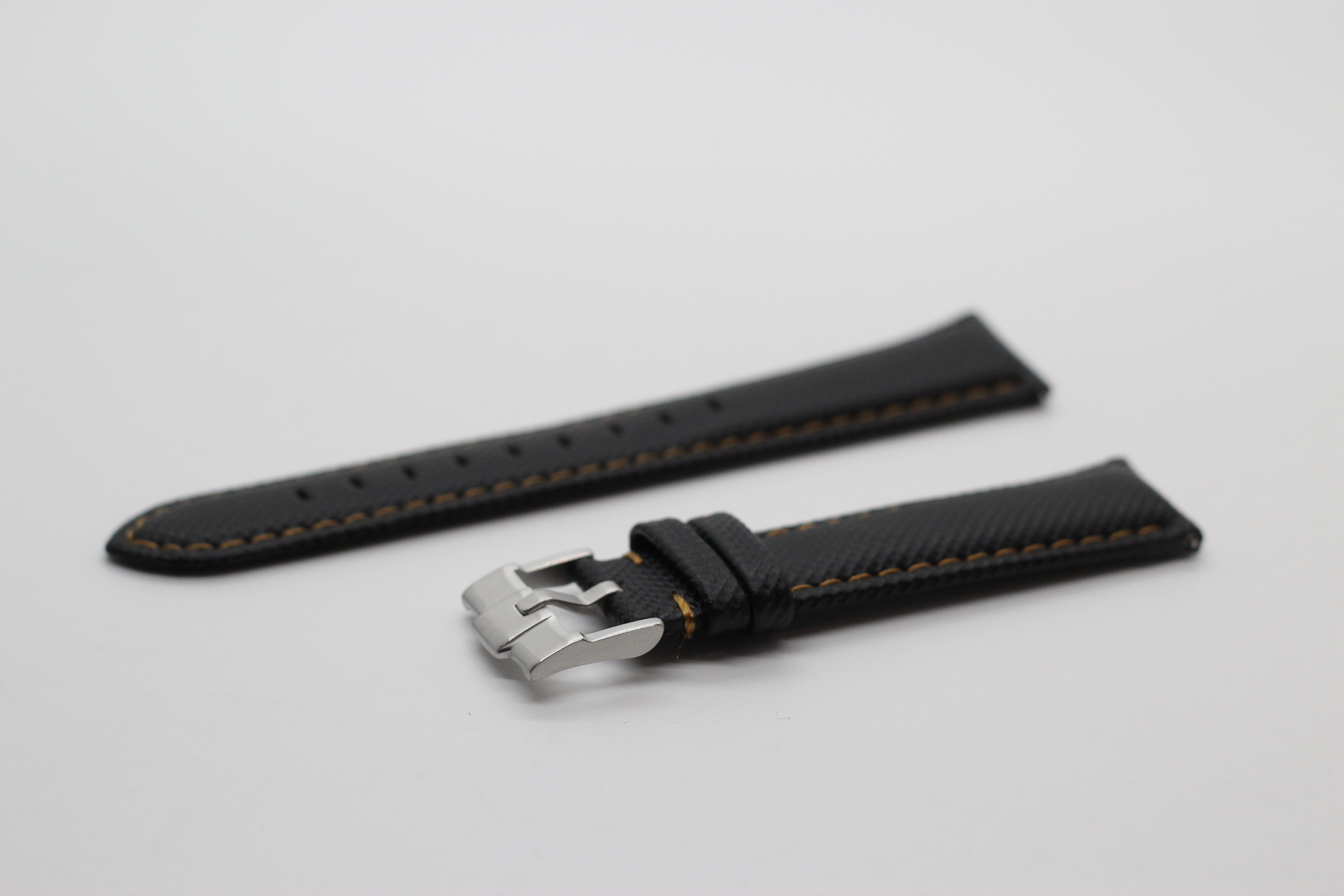 Black sailcloth quick release watch strap with gold stitching and stainless steel buckle clasp