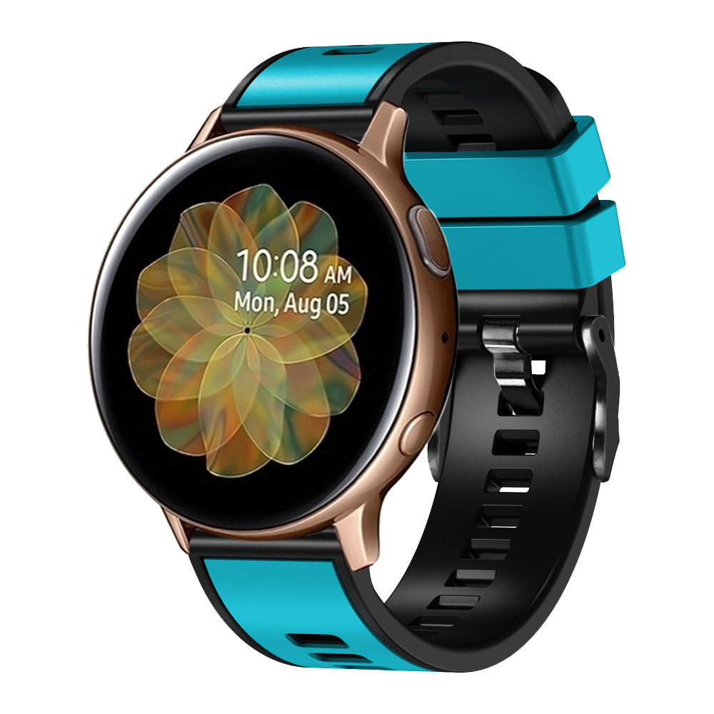 Smartwatch with rose gold case, turquoise and black two-tone silicone band, quick release strap, displaying time and date on AMOLED screen