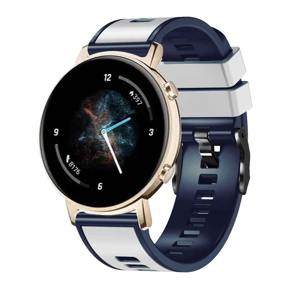 Gold smartwatch with navy and white two-tone silicone band, quick release mechanism, and black hardware clasp