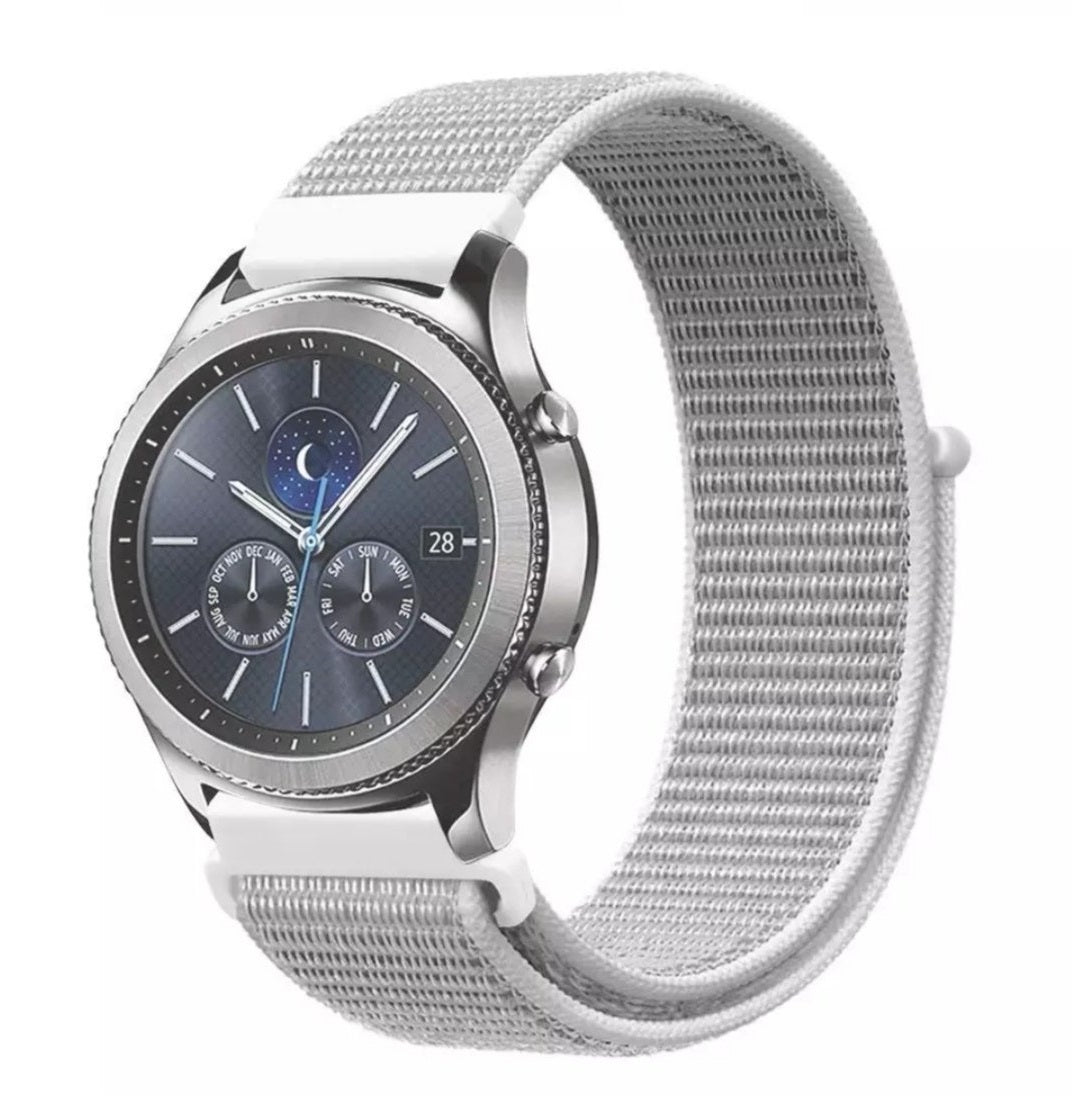 Silver sports smartwatch with moon phase dial and gray nylon velcro loop band