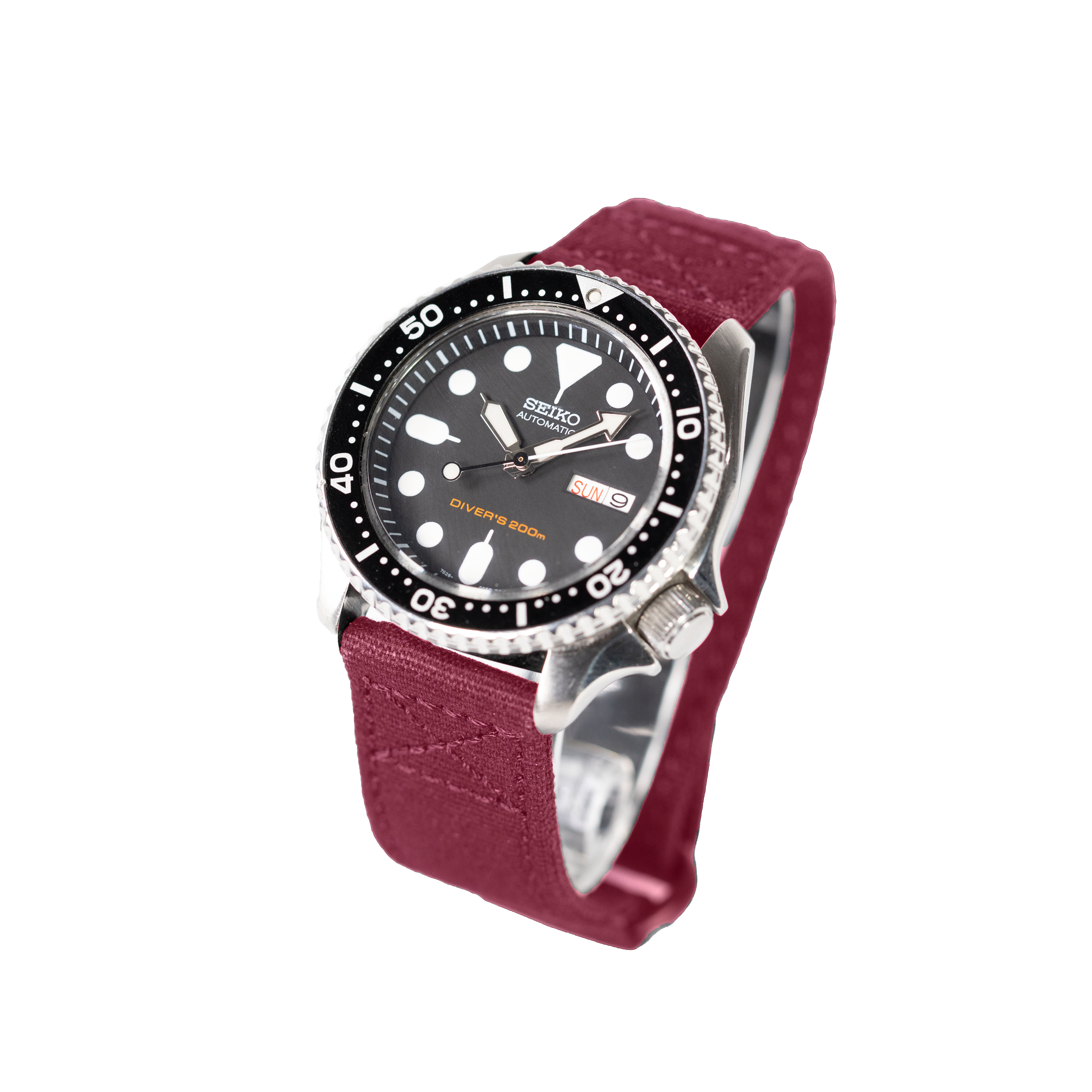 Seiko automatic diver watch with black dial, white dot markers, burgundy quick-release velcro strap, and 200m water resistance rating