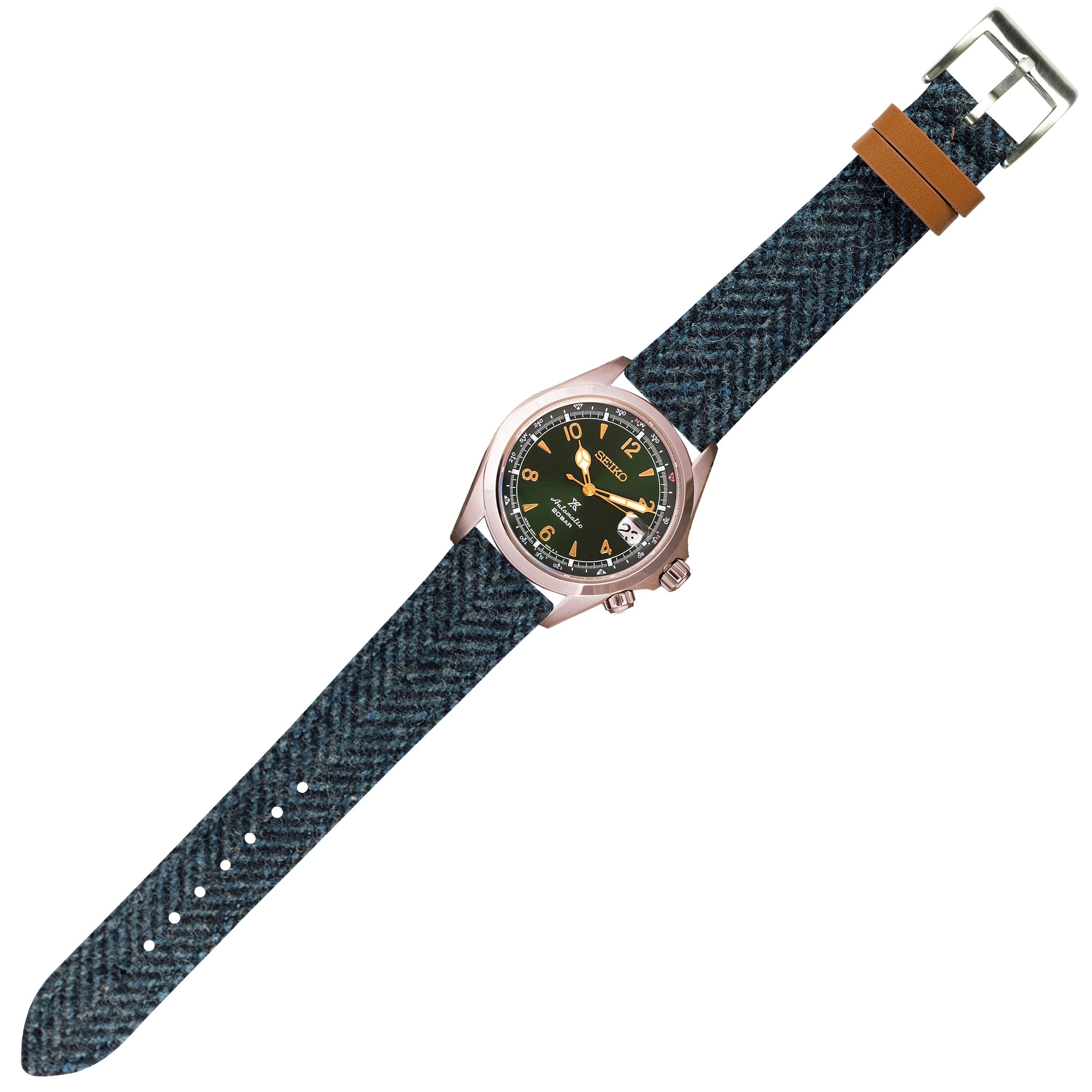Seiko watch with rose gold case, black dial, and blue herringbone Harris Tweed quick release strap with tan leather keeper